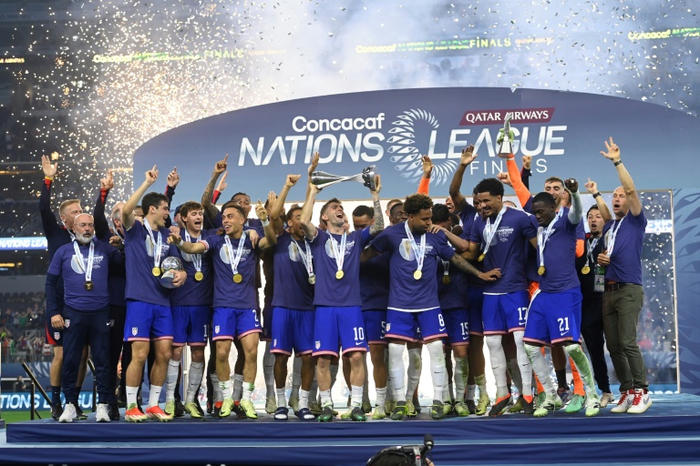 United States players celebrate capturing a third consecutive CONCACAF Nations League title by defeating Mexico 2-0 in the final (Click Thompson)